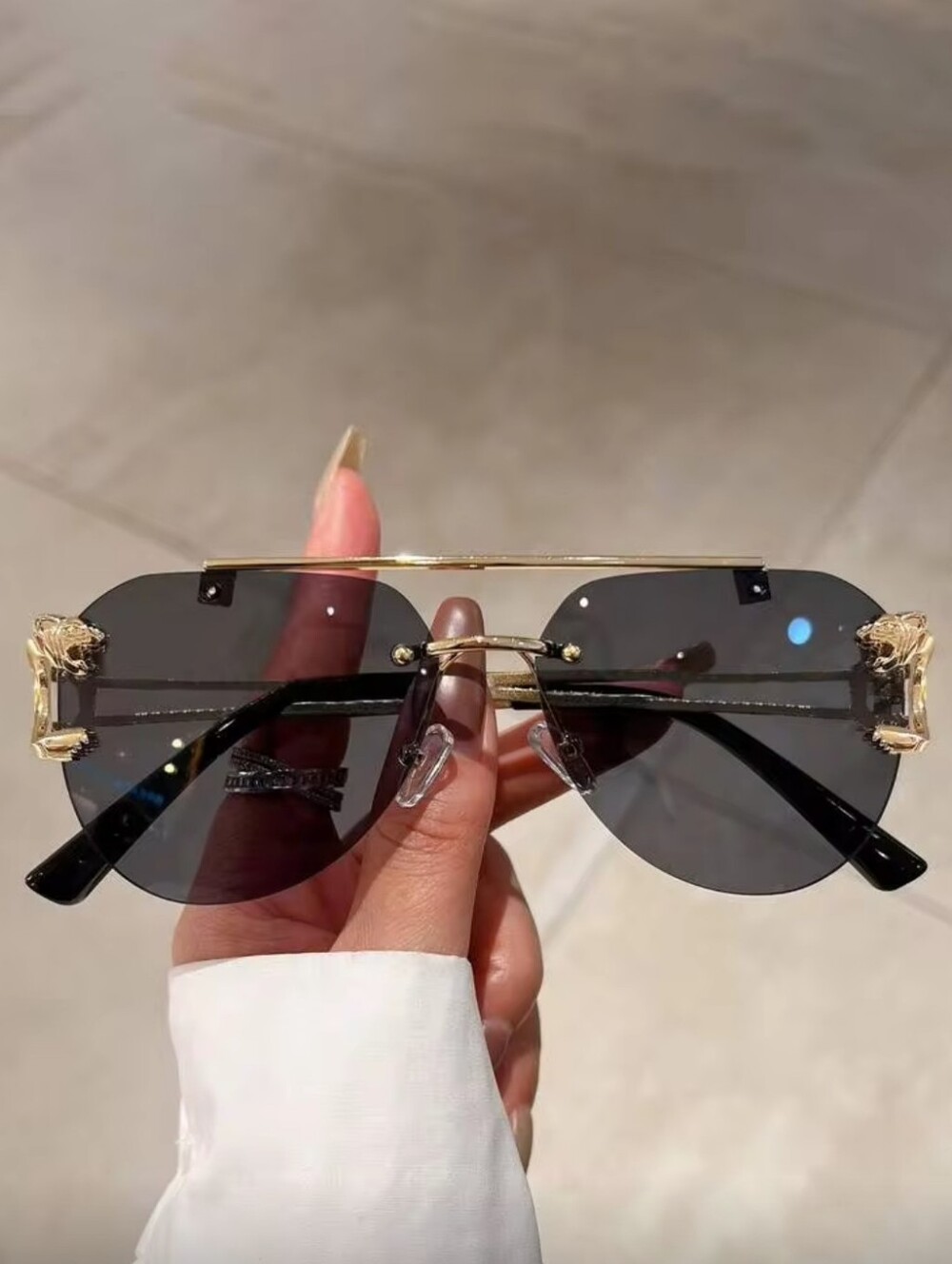 Rimless Black Lens Sunglasses with Gold Frame Accents